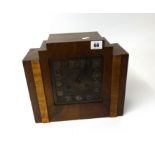 Art Deco style oak cased mantle clock with chiming movement.
