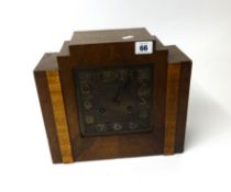 Art Deco style oak cased mantle clock with chiming movement.