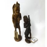 Two African wood carvings of figures, one with a crocodile, the tallest 52cm.