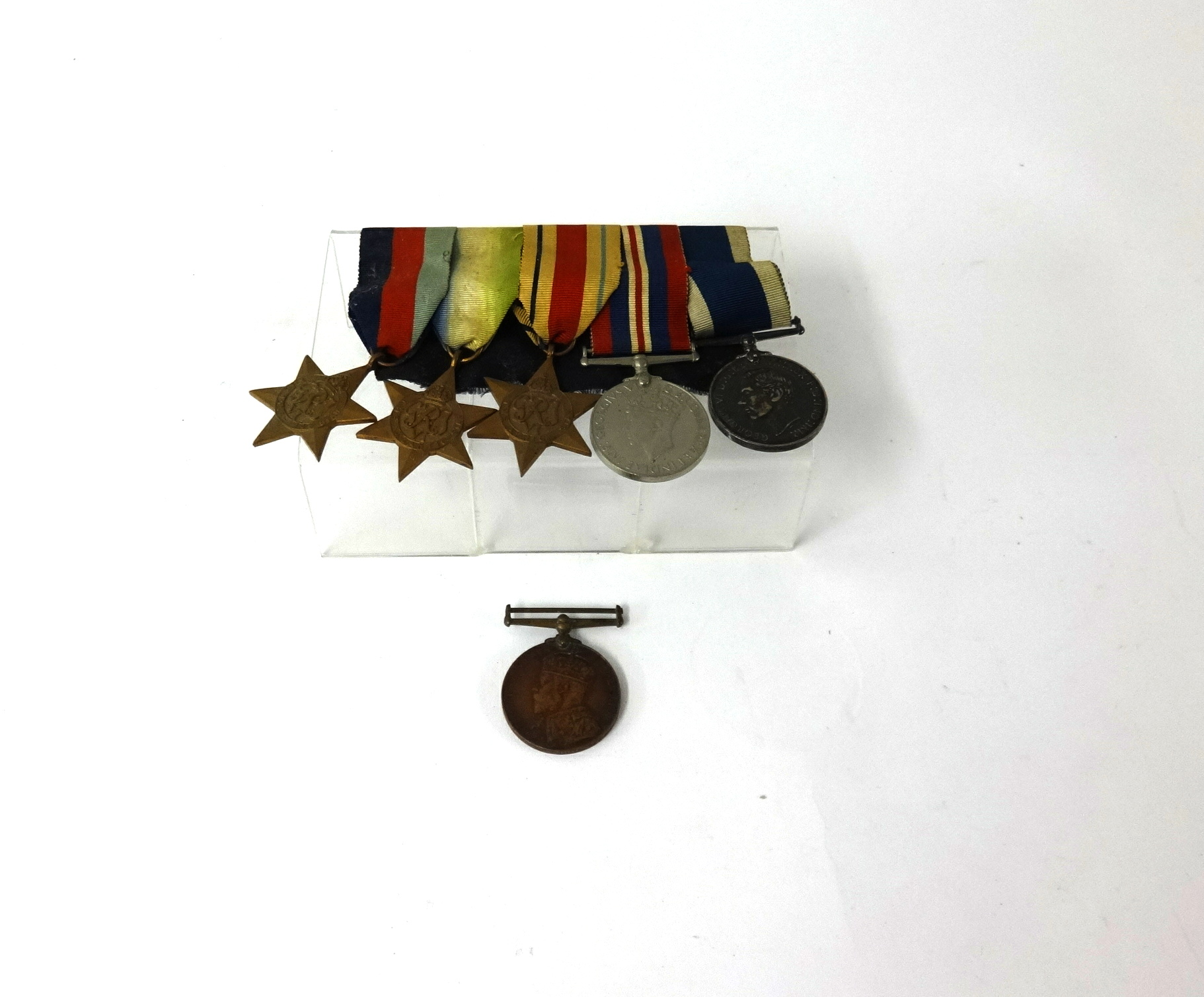 Five WWII medals including LSGC medal 247720 C.E.Grant HMS Drake and a coronation medal to J.Wyatt