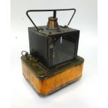 A Railway portable Oil Lamp, black, square copper base, embossed as follows on side of copper