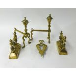 A pair of 19th Century brass fire dogs, a pair of andirons and trivet.
