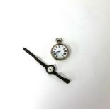 A large nickel open face pocket watch, keyless movement together with a vintage wristwatch by West