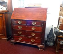 A reproduction mahogany bureau of Georgian design.