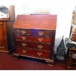 A reproduction mahogany bureau of Georgian design.