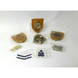 Navy memorabilia including seven ships crests, cloth patches, buttons, etc.