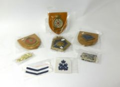 Navy memorabilia including seven ships crests, cloth patches, buttons, etc.