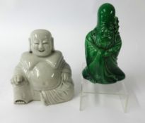 A blanc de chine porcelain Buddha, height 17cm and a green glazed figure (2).