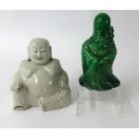 A blanc de chine porcelain Buddha, height 17cm and a green glazed figure (2).