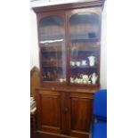 Early 20th Century mahogany library bookcase in two sections.