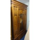 An early 20th Century pitch pine single door wardrobe.
