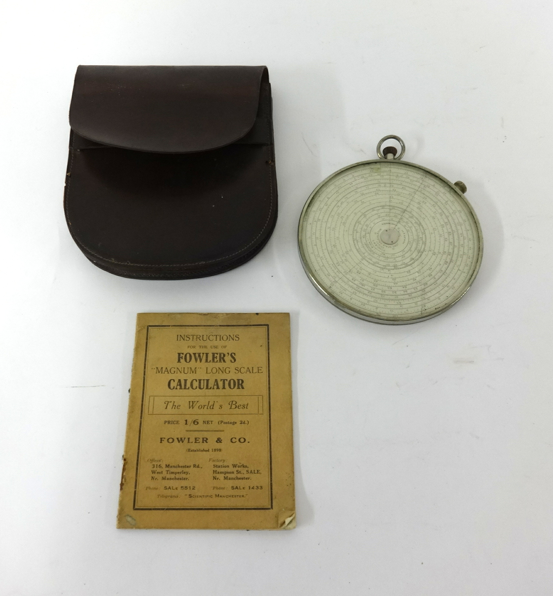 Fowler's Magnum long scale circular calculator with leather case and instructions.