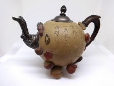 A Chinese Yixing teapot and cover 19th/20th Century of globular form applied with various nuts and