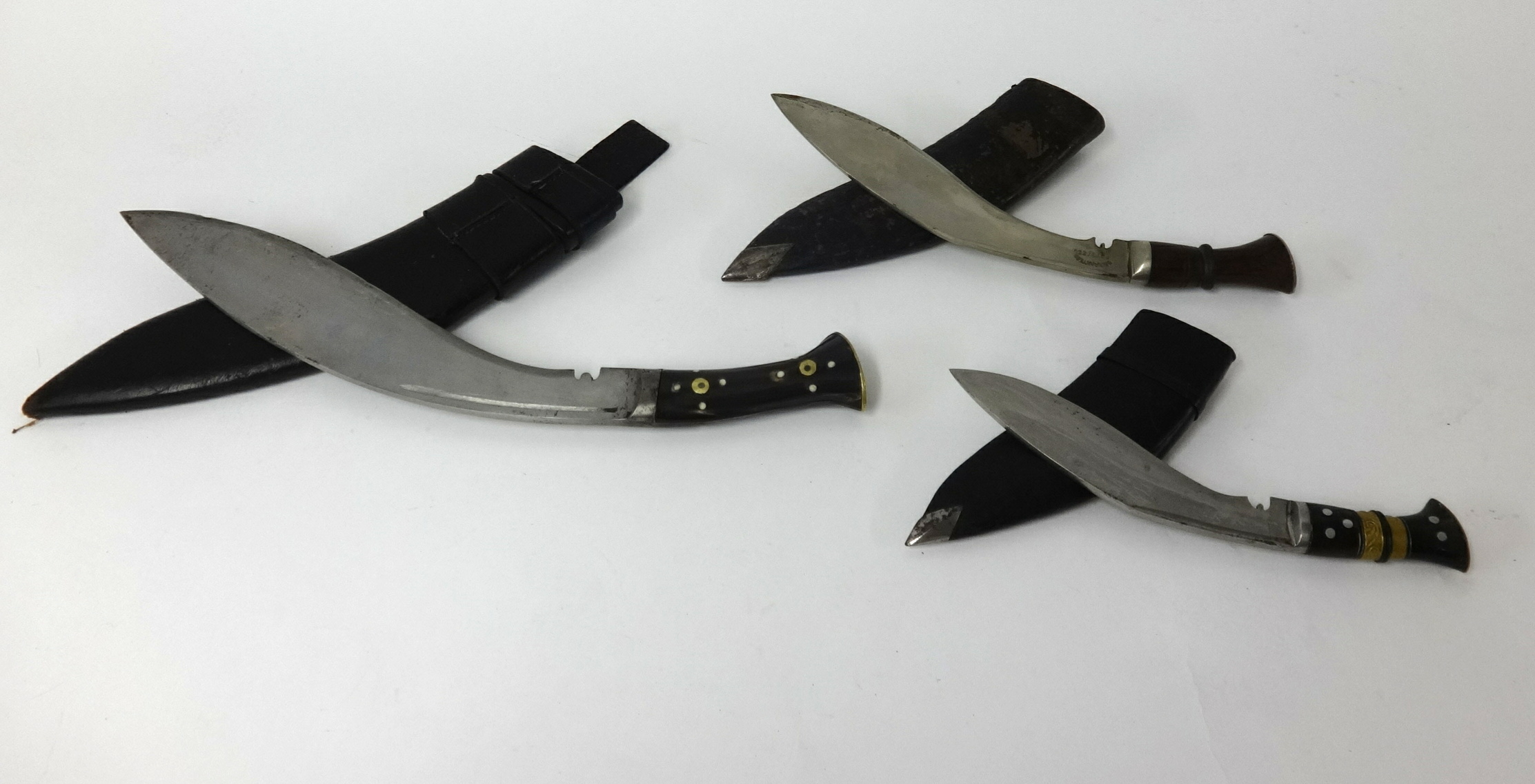 Three kukri knives including an Indian made guaranteed steel post WWII kukri knife (3).