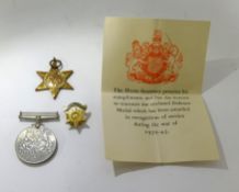 A group of five WWII medals, boxed and a Burma Star badge.