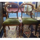 A set of four Victorian mahogany framed balloon back dining chairs.