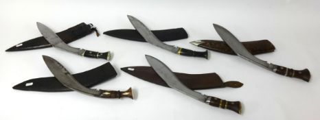 A collection of five kukri knives including a potential WWII Army Contract kukri knife with original