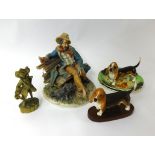 A Capodimonte porcelain figure, Beswick hounds and brass ware.