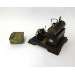 A German tin plate steam stationary engine by Gamage, London, boxed.