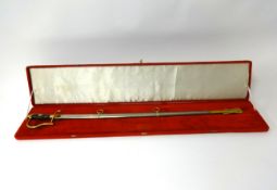 A mid 20th Century Turkish ceremonial sword and scabbard in red velvet case.
