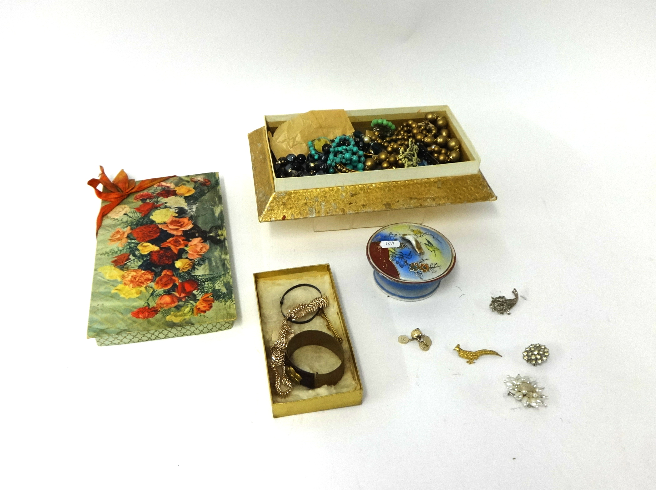 A quantity of assorted costume jewellery including watches, some porcelain and objects.