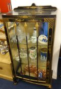 A glass display cabinet with oriental lacquered decoration together with a similar occasional