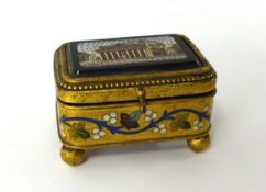 A 19th Century micro mosaic box with enamel decoration, bun feet, length approx 7cm, height 4cm.