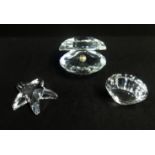 Swarovski, a collection consisting of Pear in shell, Star Fish, Sea Shell and Shark.