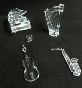 Swarovski, a collection of musical instruments including a harp, piano, saxophone and cello.