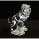 Swarovski, Lion standing on rock.