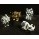 Swarovski, a collection of three Elephants and one Rhino.