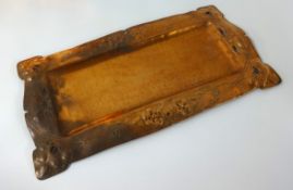 A Newlyn style copper rectangular tray, the border with embossed floral and pierced decoration, 41cm