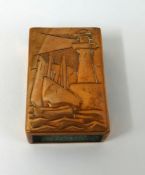 A Newlyn copper matchbox holder embossed with lighthouse and sailing boats, the reverse impressed '