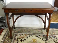 A small mahogany stained wood writing table, width 80cm.