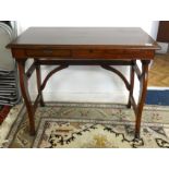 A small mahogany stained wood writing table, width 80cm.