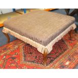 A large upholstered square stool on cabriole legs, approx 100cm x 100xm.