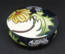 Moorcroft, lidded dish with daisy may pattern.