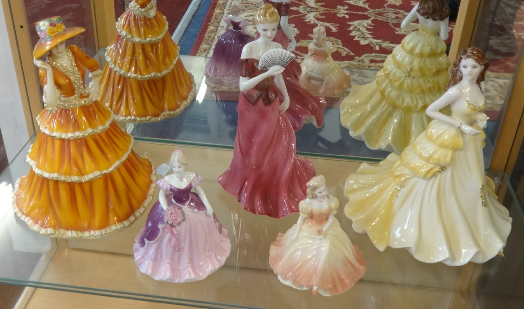 A collection of 19 porcelain figurines including Coalport, Doulton Pretty Ladies series and - Image 3 of 3