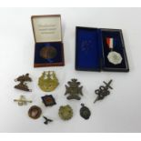 Various medallions, cap badges, Marabout badge and coronation medal.