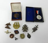 Various medallions, cap badges, Marabout badge and coronation medal.