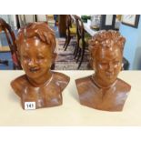 A pair of carved wood busts, girl and boy, height 23cm.