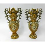 A pair of ornate Victorian pottery vases, height 42cm.