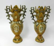 A pair of ornate Victorian pottery vases, height 42cm.