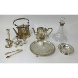 Silver plated tea pots, candlesticks and flat bottom glass decanter with silver collar.