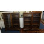 A pair of mahogany bookcases with astragal glazing bars on short cabriole legs.