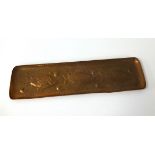 A Newlyn copper rectangular tray embossed with three fish, stamped 'Newlyn', on the front, 26cm x