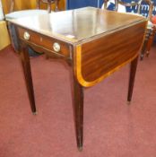 A reproduction Pembroke table of Georgian design, with wide cross banding and square tapered legs,