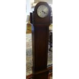 A mid 20th Century oak grand daughter clock with key and pendulum.