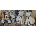 Three pairs of reproduction Staffordshire style cats.