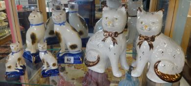 Three pairs of reproduction Staffordshire style cats.